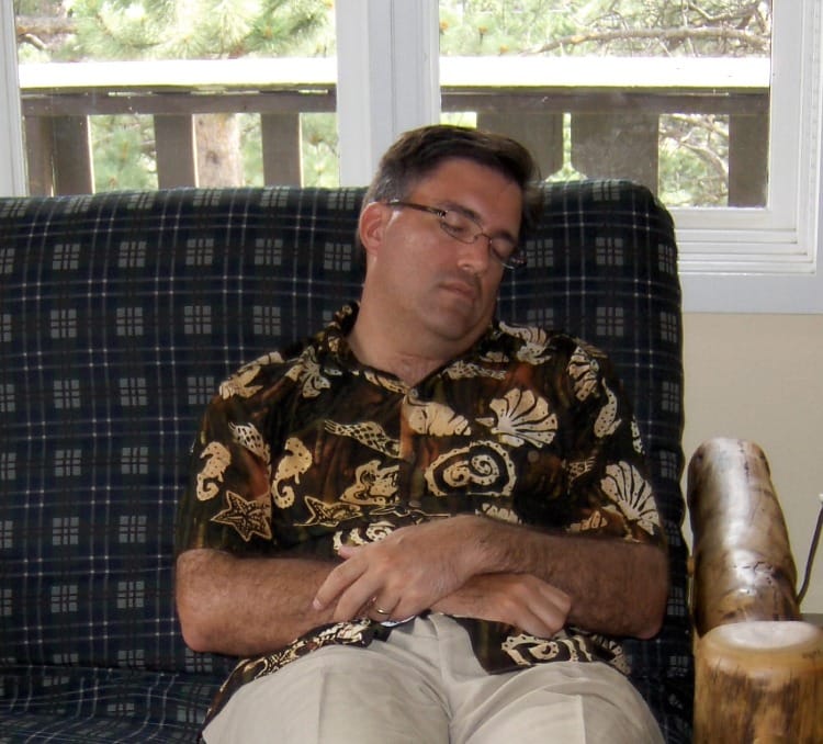 Picture of Greg Chambers sleeping on vacation