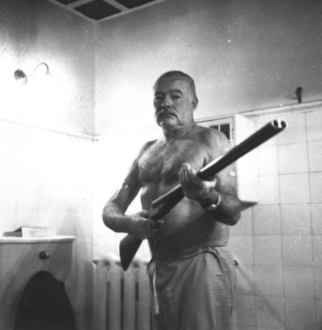 image of hemingway with a shotgun from the JFK library