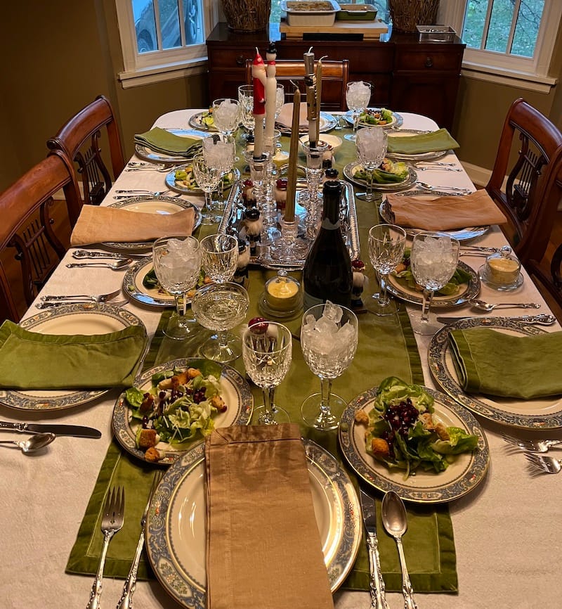 A fancy table set for Christmas dinner.