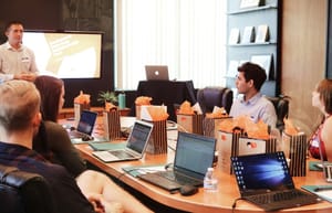 new hires in a conference room getting a taste of company culture